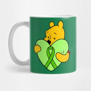 Yellow bear hugging green Awareness ribbon Mug